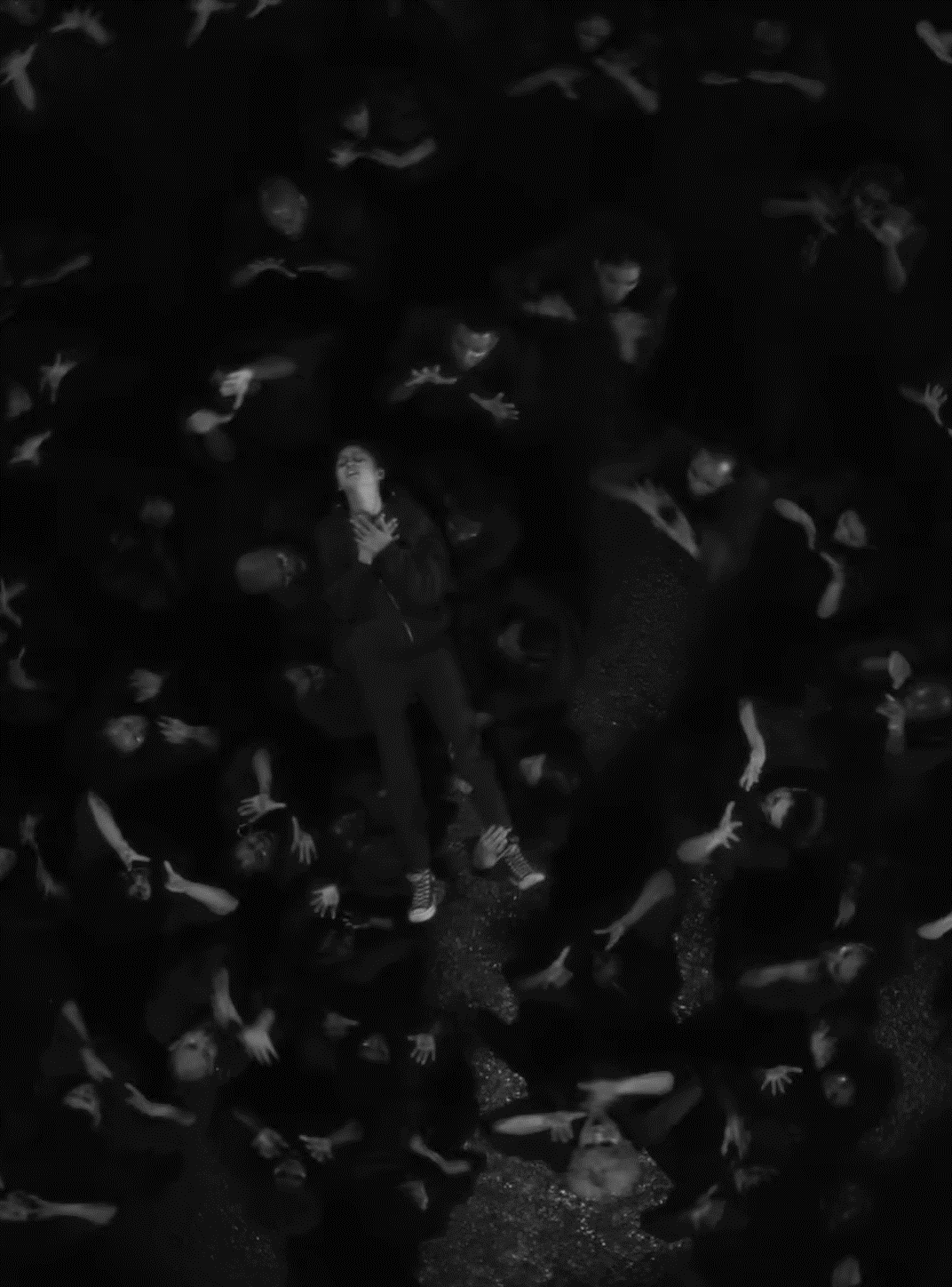 Hands for e-reader wallpaper featuring crowd and figure and more